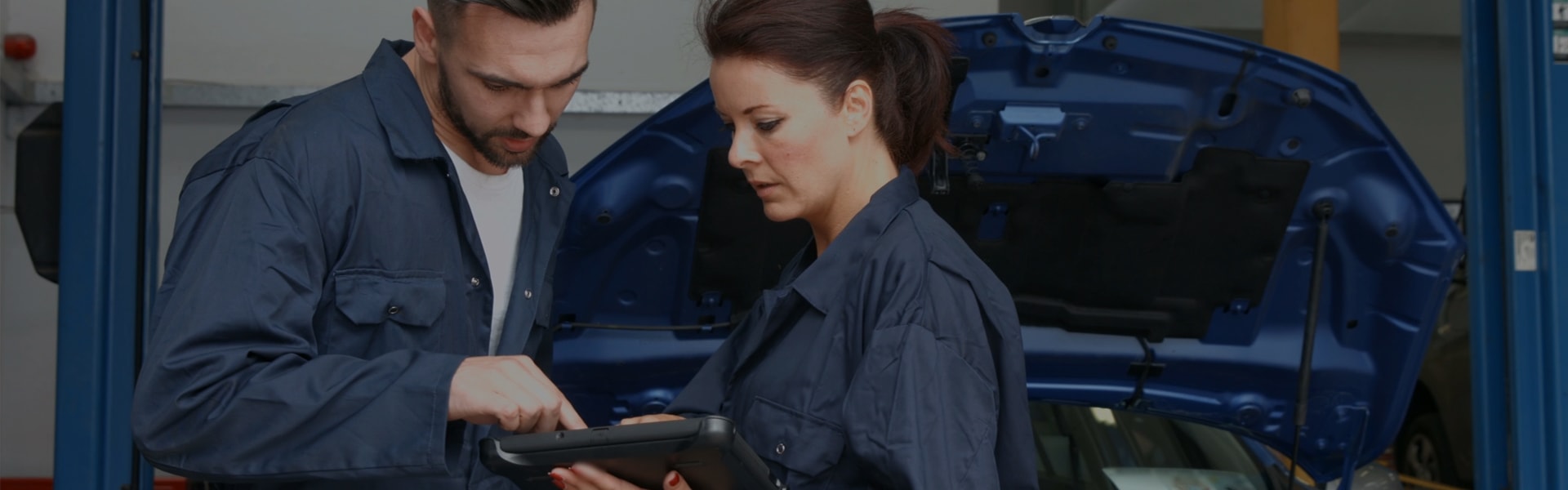 Auto Technicians Looking at iPad