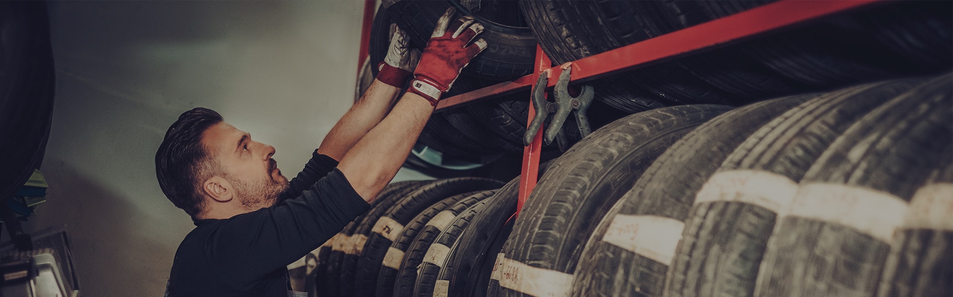 Tire Technician Pulling Tire